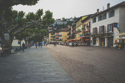 View of people walking in front of building