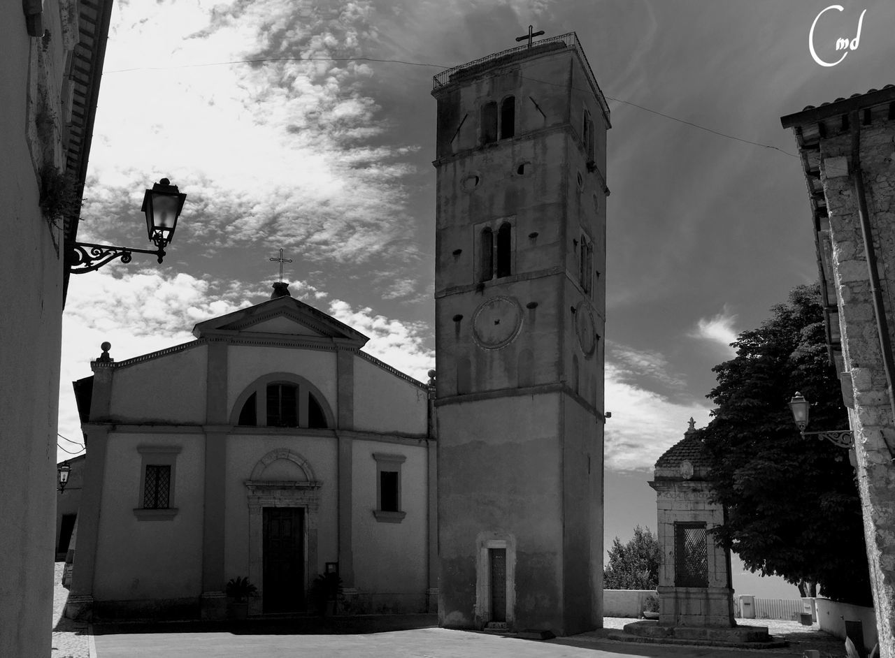 building exterior, architecture, built structure, low angle view, religion, church, sky, place of worship, street light, spirituality, street, history, old, outdoors, cross, building, day, cloud - sky