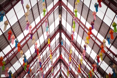 Low angle view of multi colored lanterns hanging from ceiling