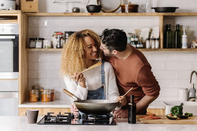 Woman preparing food in kitchen at home