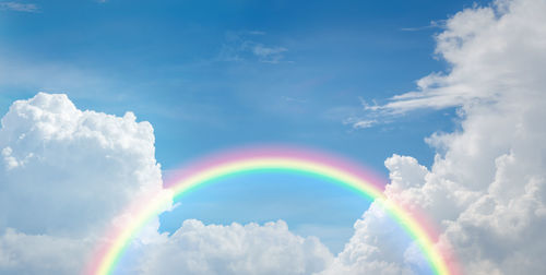 Low angle view of rainbow against sky