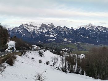 Scenic view of snowcapped mountains against sky