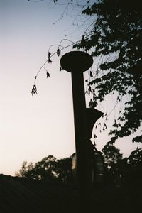 Low angle view of silhouette tree against sky