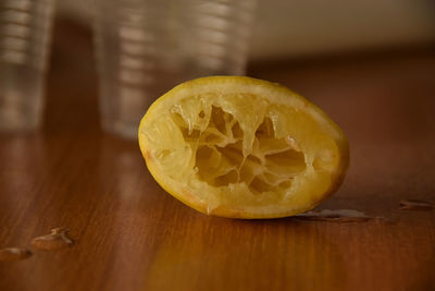 Close-up of squeezed lemon on table