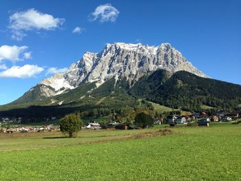 Scenic view of landscape and mountains against sky