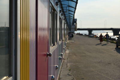 Train at railroad station platform against sky