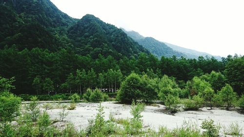 Scenic view of lake with mountains in background