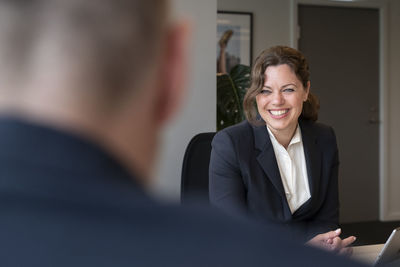 Smiling businesswoman in office