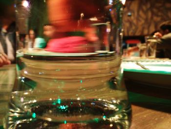 Close-up of beer glass on table