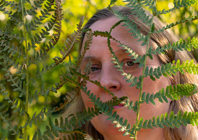 Posing by a female model in a park at the beginning of autumn