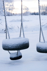 Icicles on snow covered land