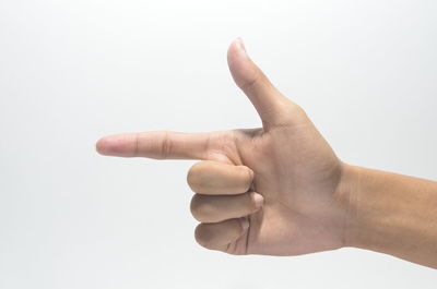 Close-up of human hand against white background