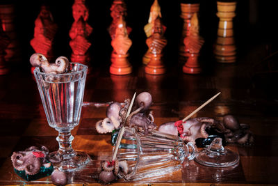 Close-up of wine glasses on table