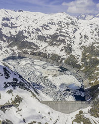 Scenic view of snow covered mountains