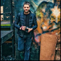 Portrait of young man photographing