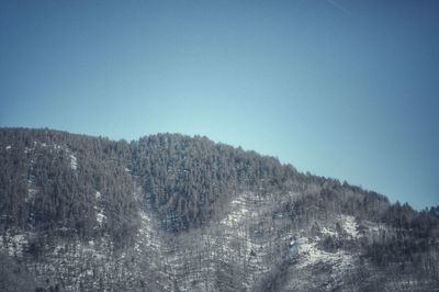 Scenic view of mountains against clear blue sky