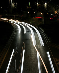 High angle view of light trails on road at night