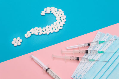 High angle view of text on table against blue background