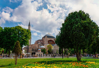 Panoramic view of trees and buildings against sky