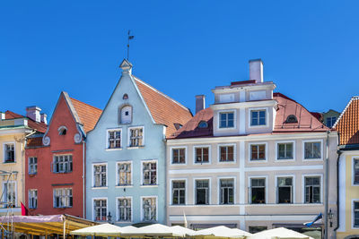 Low angle view of building against clear blue sky