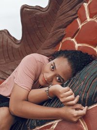 Portrait of woman sitting outdoors