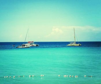 Boats sailing in sea