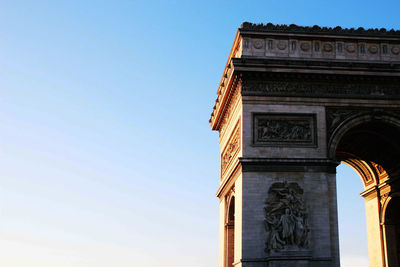 Low angle view of built structure against clear blue sky