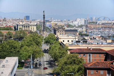 High angle view of trees and buildings against sky