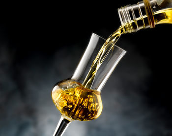 Low angle view of lighting equipment against black background