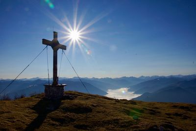 Scenic view of mountains against bright sun