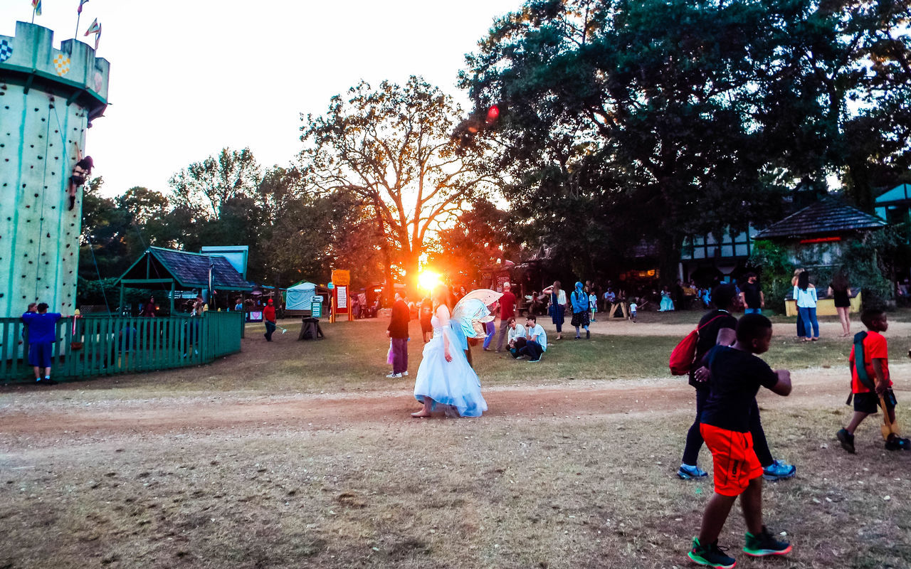 PEOPLE PLAYING AT PARK