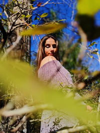 Portrait of young woman in sunlight