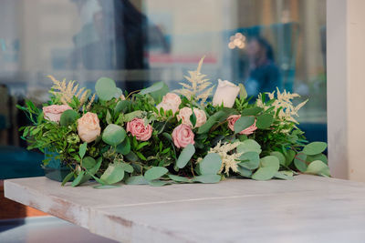 Close-up of pink roses on table