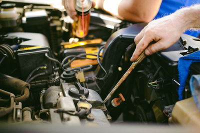 Mechanics repairing car at garage