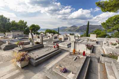 High angle view of cemetery against sky in city