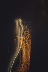 Light trails against sky at night