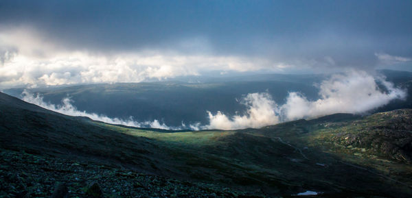 Countryside landscape against clouds