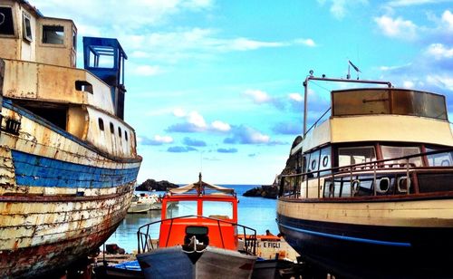 Boats moored at harbor