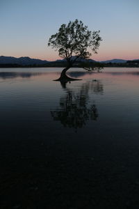 Scenic view of lake against sky during sunset