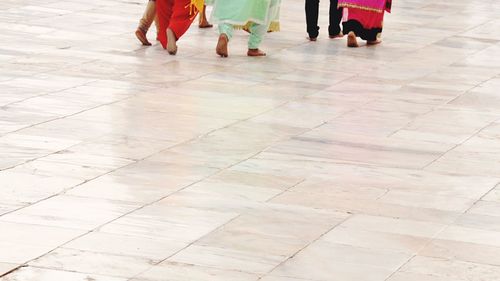 Low section of people standing on floor