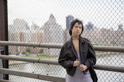 Young woman on a bridge in queens, new york