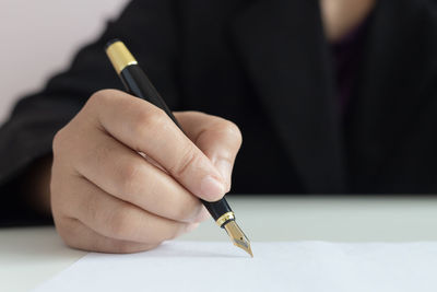 Close-up of hand holding paper