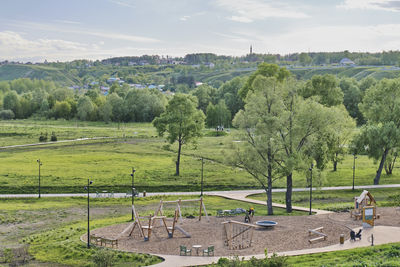 view of playground in park of culture and recreation shishkin ponds. spring cityscape.