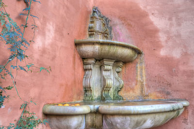 Close-up of statue against building