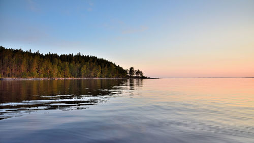 Scenic view of lake against sky during sunset