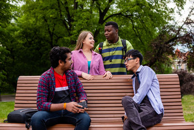 People sitting on bench in park