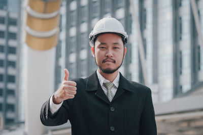 Portrait of young man standing outdoors