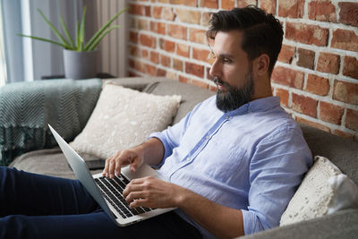 Man using laptop at office