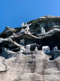 Low angle view of buildings against blue sky