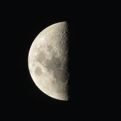 Low angle view of moon against sky at night